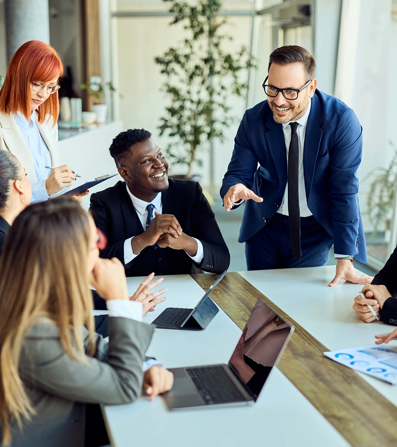Business meeting with diverse team discussing ideas.