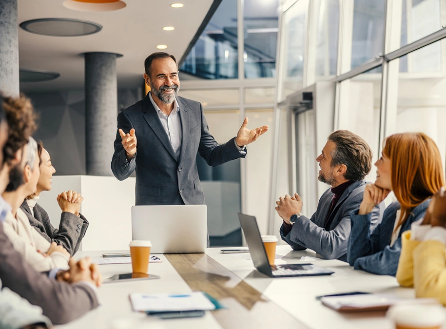 Man presenting in a modern office meeting.