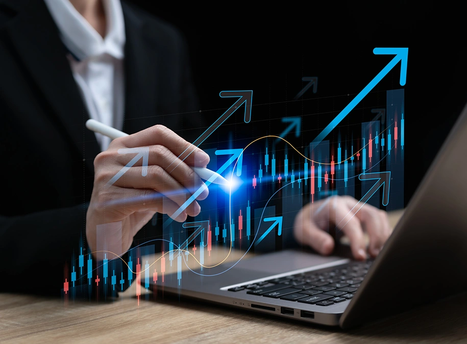 Person analyzing stock market data on laptop.